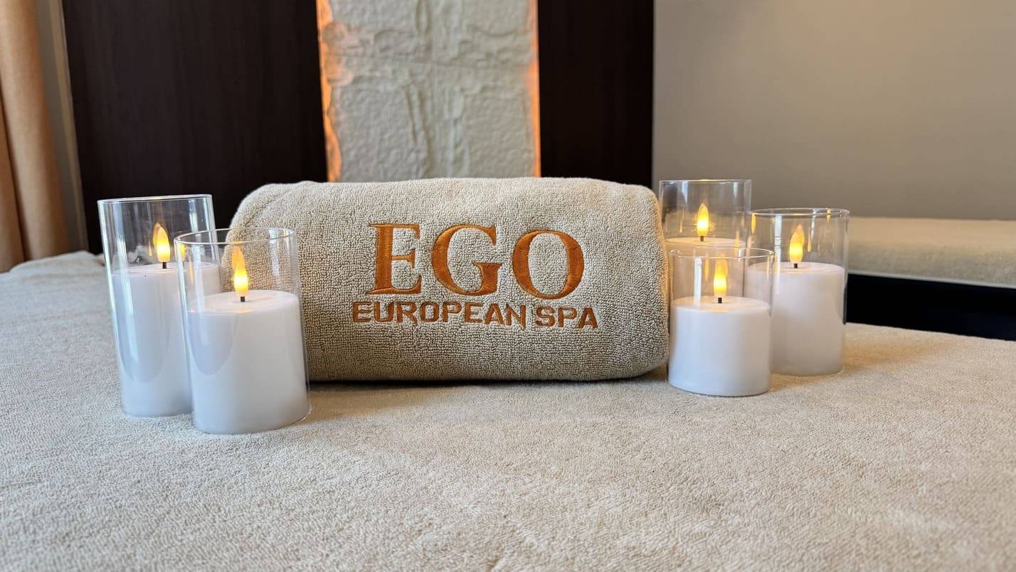 Candle-lit treatment room at Ego European Spa Dubai prepared for a Swedish massage